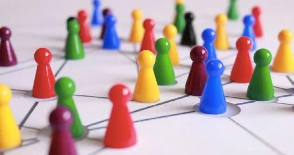 Colourful game pieces connected in a network