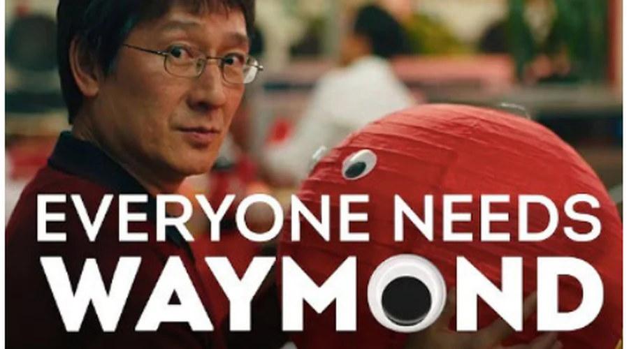 Waymond Wang holding a red balloon with googly eyes, under the title “Everyone needs Waymond”
